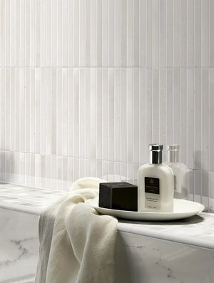 Cozy Milk 5x10 Polished Porcelain – white glossy tile wall behind a bathroom vanity